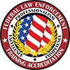 Federal Law Enforcement Training Accreditation seal with the words Professionalism, Competence, and Excellence